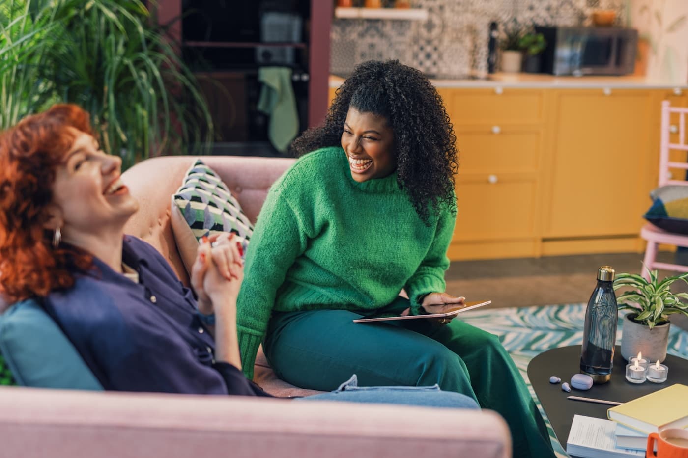 A student speaking with a therapist in a warm therapy room